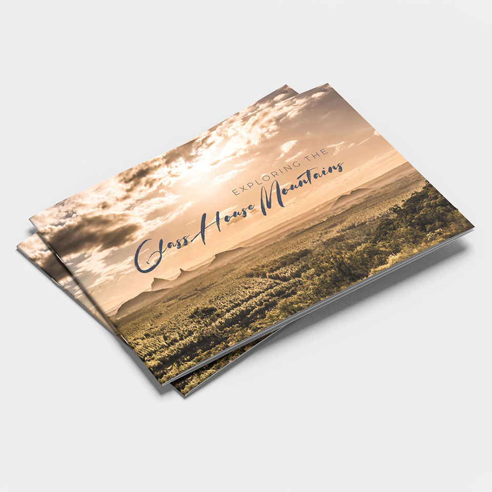 Brochure cover with a landscape view of the Glass House Mountains at sunset.
